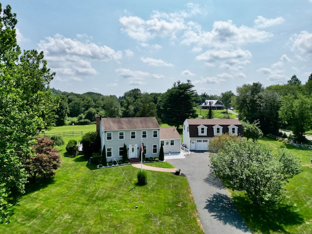 view of front of property with a garage and a front yard