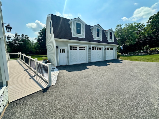 view of property exterior with a garage