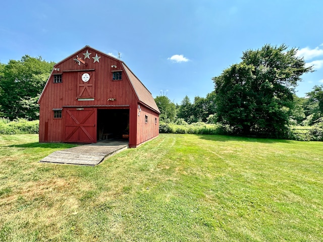 view of outbuilding with a yard