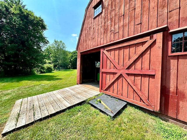 view of outbuilding with a lawn