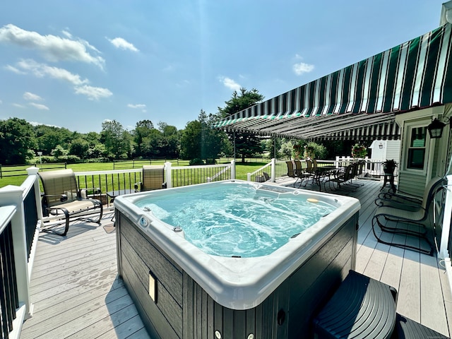 wooden terrace with a hot tub