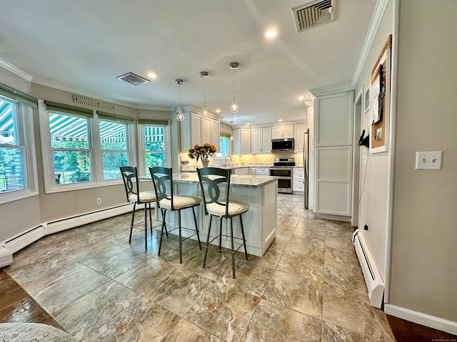 kitchen with appliances with stainless steel finishes, crown molding, a baseboard heating unit, and a healthy amount of sunlight