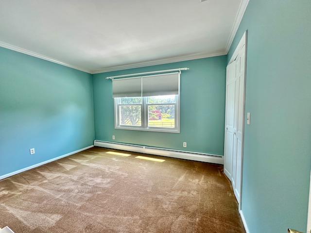 carpeted empty room with a baseboard radiator and ornamental molding