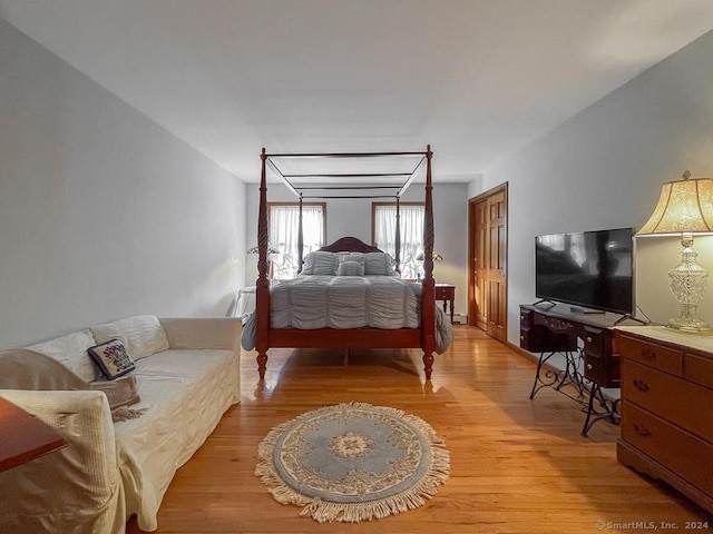 bedroom with light wood-type flooring