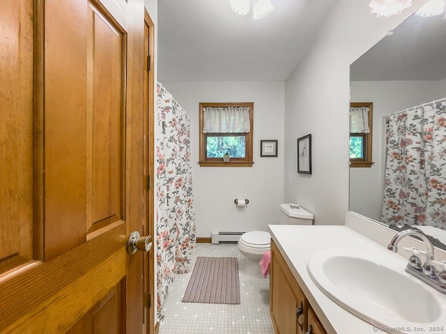 bathroom with toilet, tile patterned flooring, vanity, and a baseboard heating unit