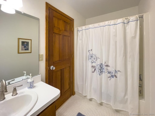 bathroom featuring tile patterned floors, vanity, and shower / bathtub combination with curtain