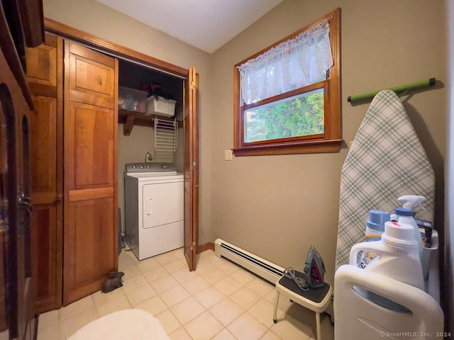 laundry area featuring washer / dryer, light tile patterned floors, and baseboard heating