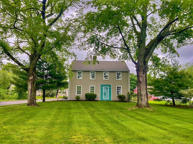 colonial home with a front yard