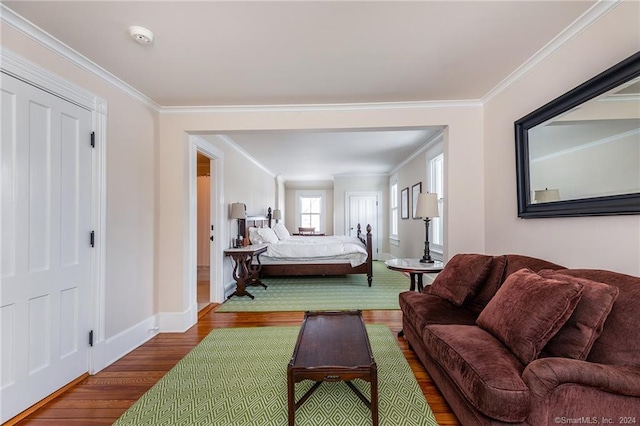 living room with ornamental molding and wood-type flooring