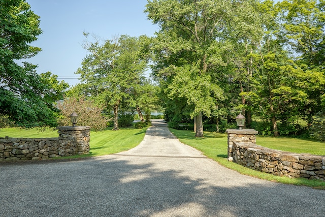 view of home's community featuring a lawn