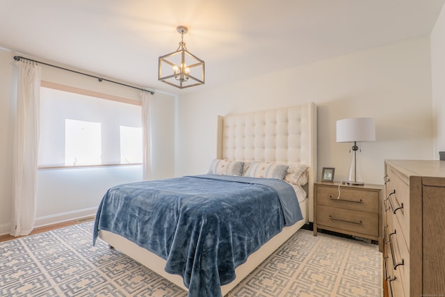 bedroom featuring an inviting chandelier