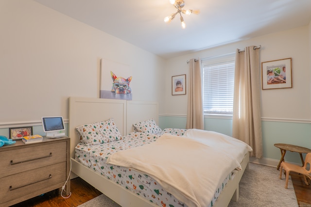 bedroom with dark wood-type flooring