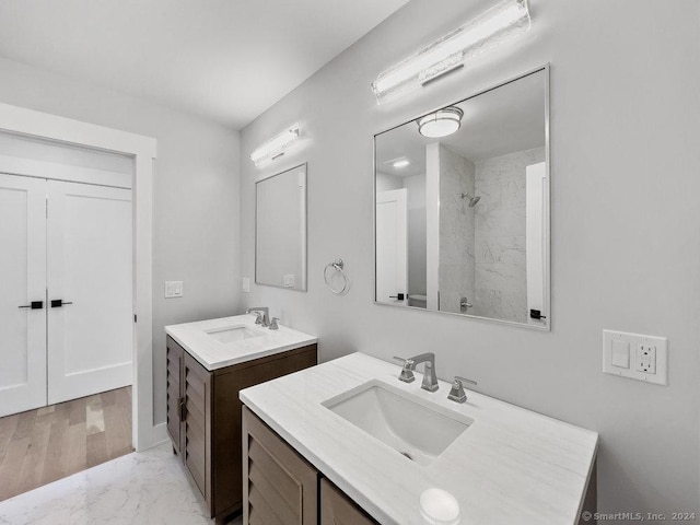 bathroom featuring vanity and a shower