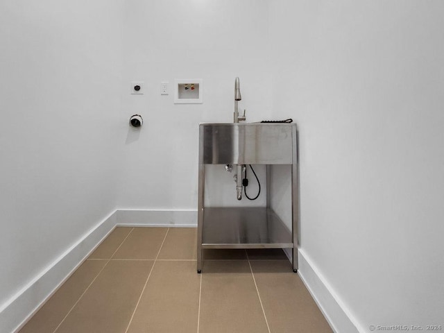 laundry area with light tile patterned flooring, hookup for a washing machine, and electric dryer hookup