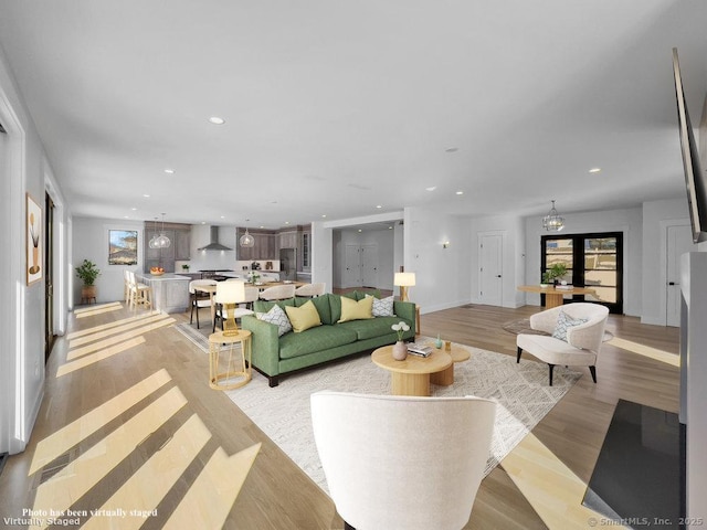 living room with light hardwood / wood-style floors