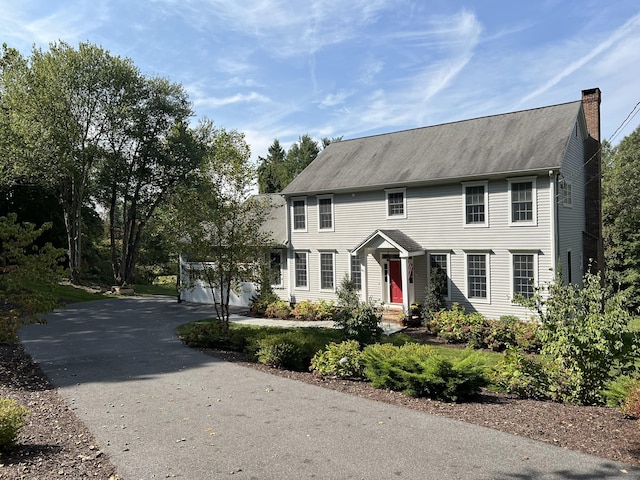 colonial-style house featuring a garage