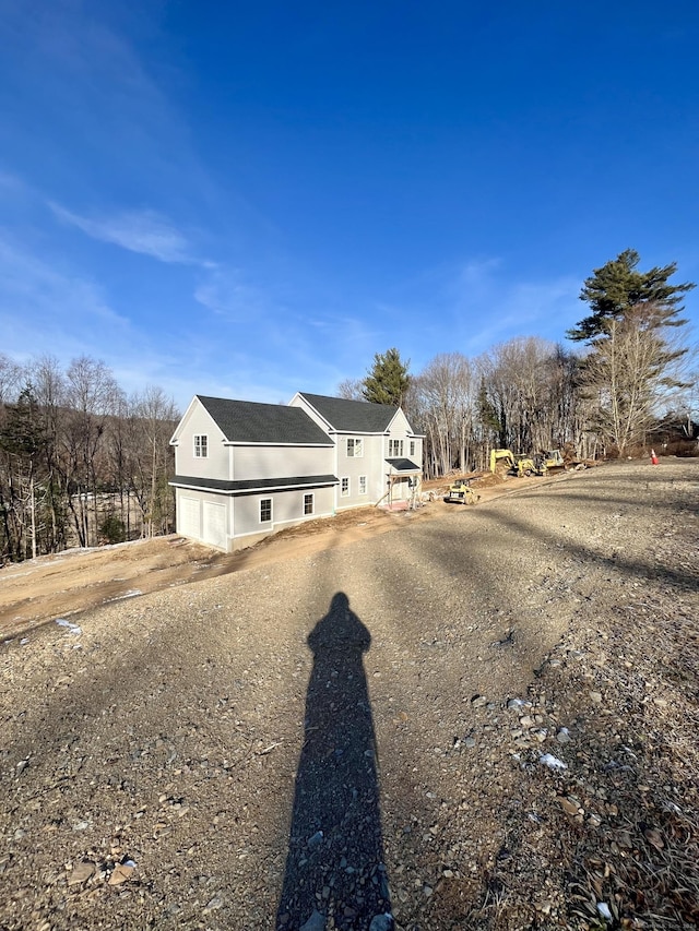 view of side of property featuring a garage