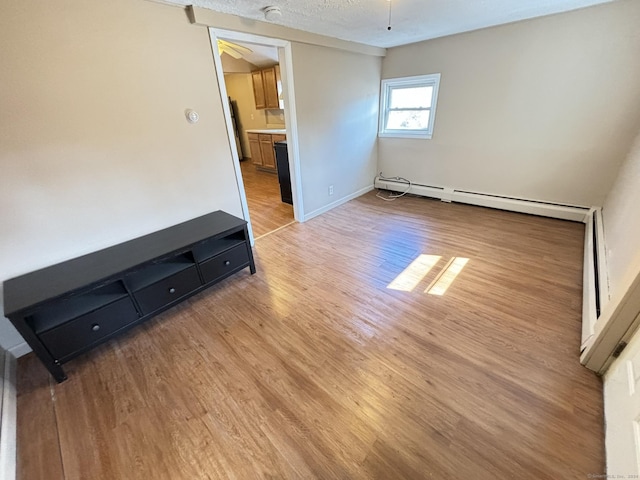 interior space featuring ceiling fan and light hardwood / wood-style floors