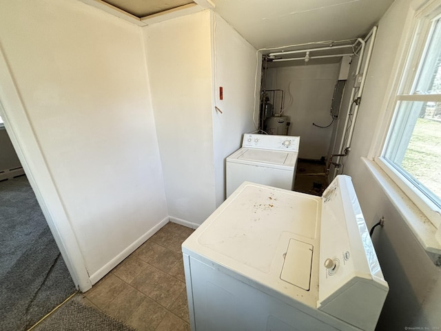 clothes washing area featuring washer and clothes dryer