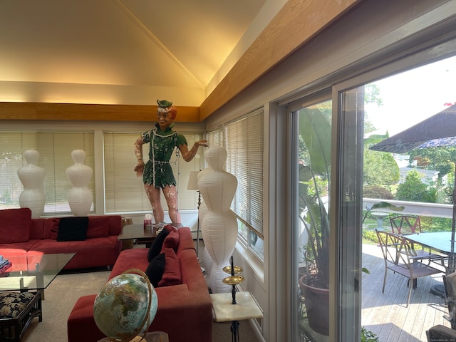 sunroom / solarium featuring lofted ceiling