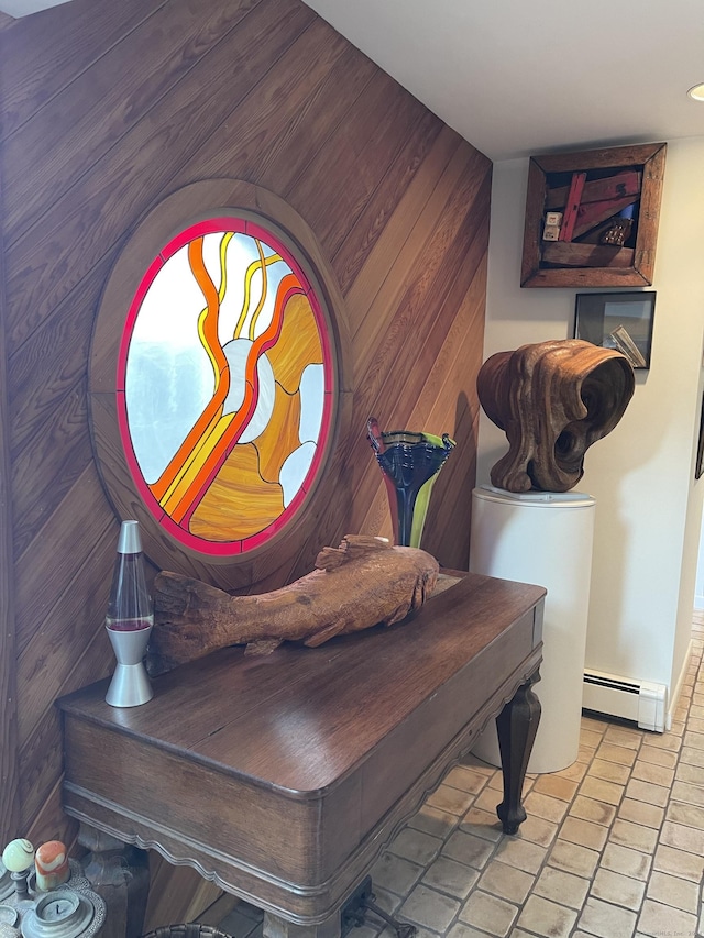 details featuring baseboard heating and wood walls