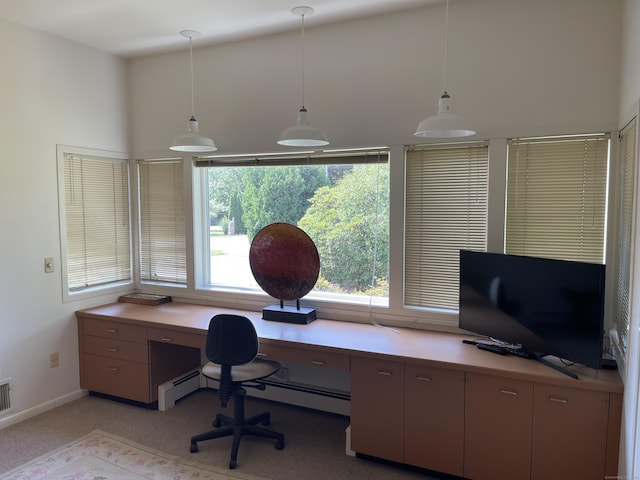 office space featuring built in study area, baseboards, light colored carpet, and visible vents