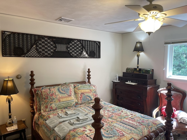 bedroom featuring visible vents and ceiling fan