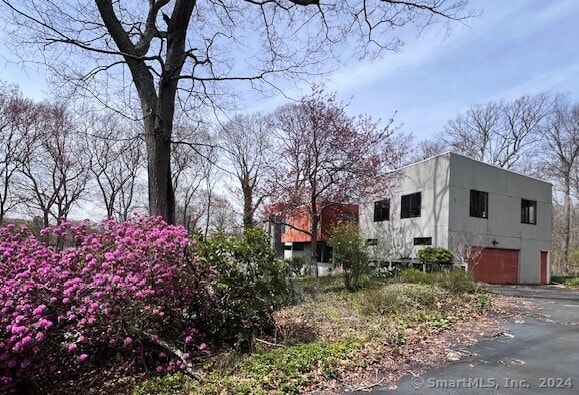 view of side of property with a garage