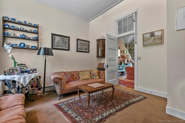 living room with dark colored carpet and baseboard heating