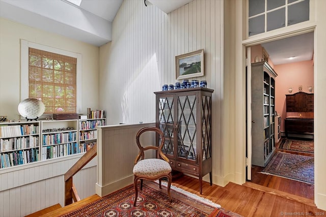 sitting room with hardwood / wood-style flooring