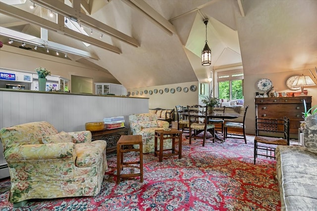 interior space with track lighting, beamed ceiling, and high vaulted ceiling