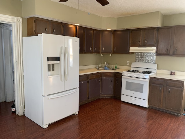 kitchen with white appliances, a textured ceiling, ceiling fan, dark wood-type flooring, and dark brown cabinetry