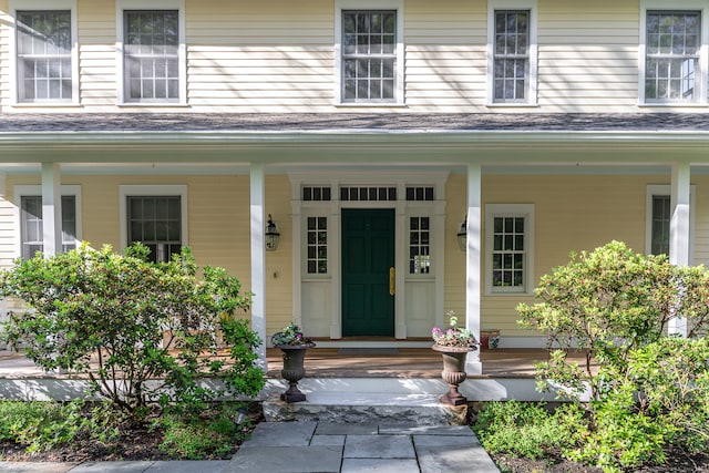 doorway to property featuring a porch