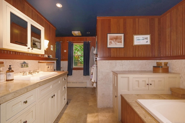 bathroom featuring vanity, a baseboard heating unit, tile patterned floors, wooden walls, and a washtub