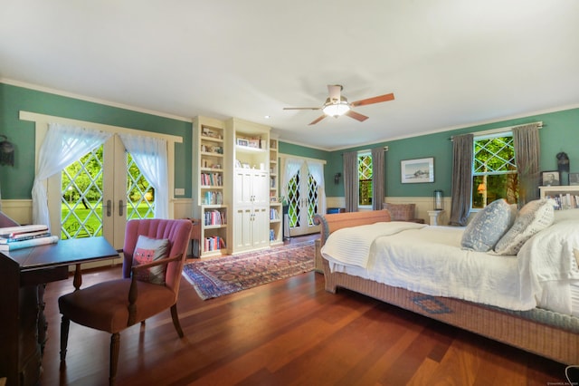 bedroom featuring multiple windows, access to outside, ceiling fan, and dark wood-type flooring