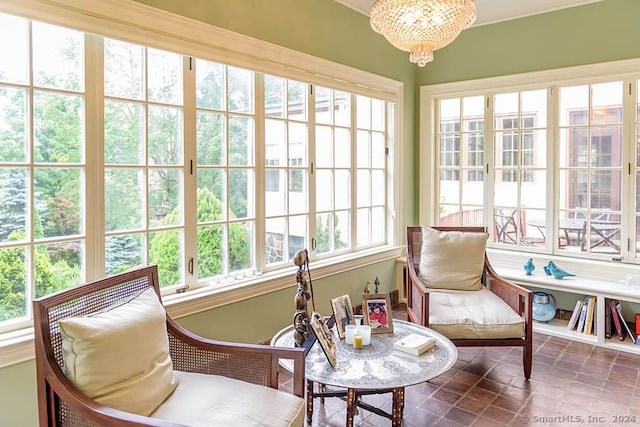 sunroom with an inviting chandelier