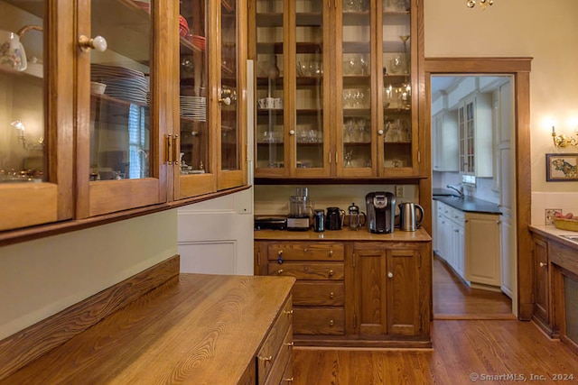 kitchen with sink and dark hardwood / wood-style flooring