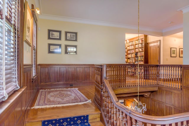 interior space featuring crown molding and dark wood-type flooring