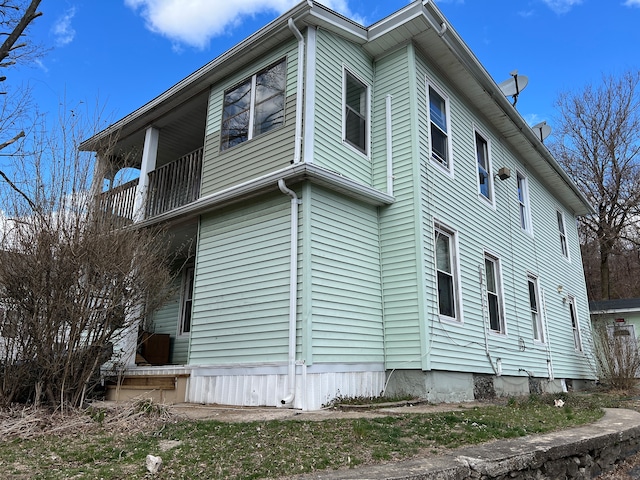 view of home's exterior featuring a balcony