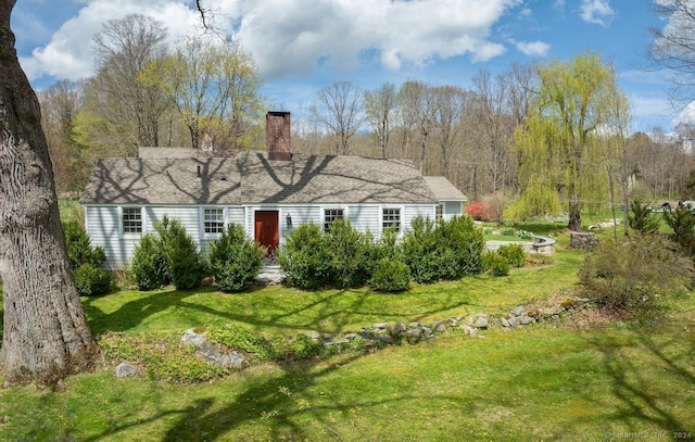 single story home with a front lawn