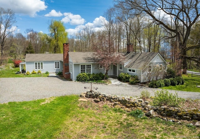 ranch-style house featuring a front lawn