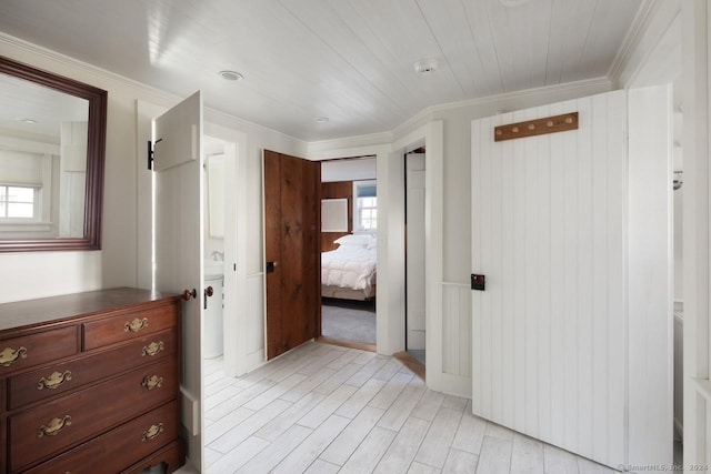 interior space featuring crown molding and a healthy amount of sunlight