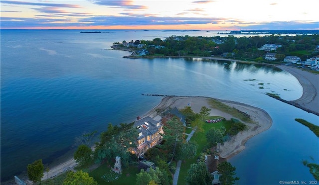 aerial view at dusk with a water view