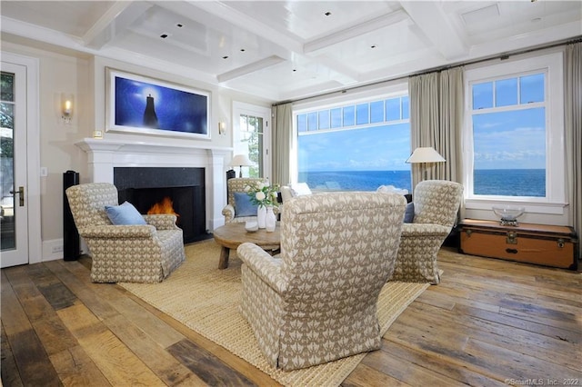 living room with wood-type flooring, coffered ceiling, and beam ceiling