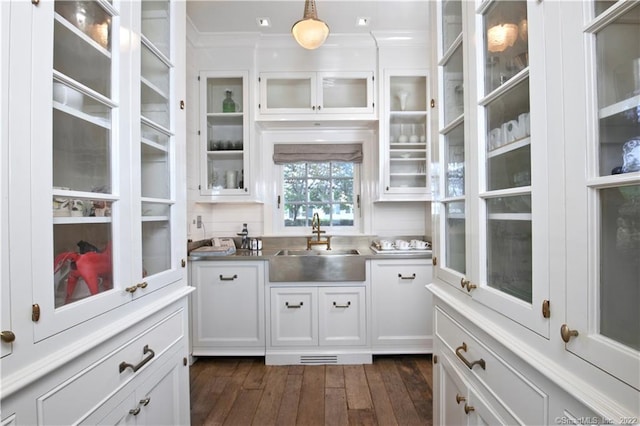 46 Compo Mill Cv, Westport, CT 06880 - kitchen with a sink, ornamental molding, white cabinetry, dark wood-type flooring, and decorative light fixtures