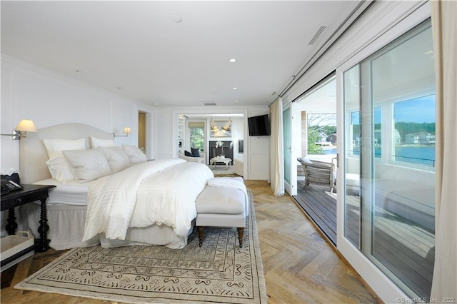 bedroom with crown molding, access to outside, and light parquet floors