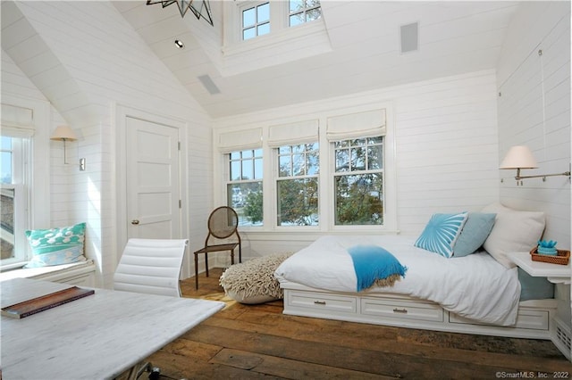 bedroom featuring wood-type flooring and vaulted ceiling