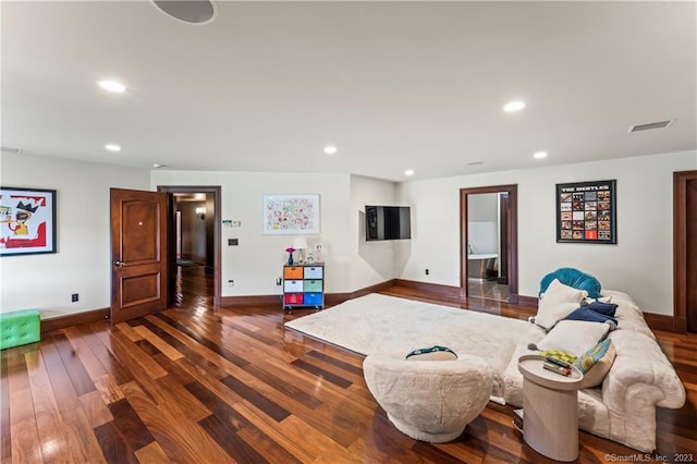 living room featuring dark hardwood / wood-style flooring