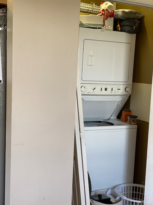 washroom with stacked washer and clothes dryer