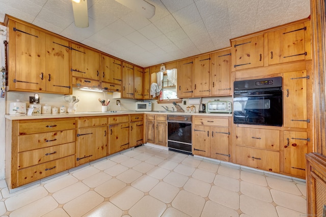 kitchen with ceiling fan, light tile floors, and black appliances